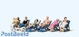 People Resting in Deckchairs