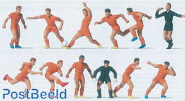 Footbalteam with a orange uniform including a referee