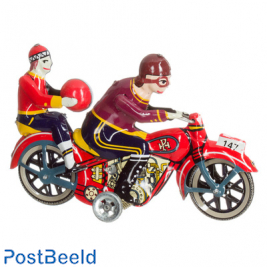 Motorcycle with passenger with ball